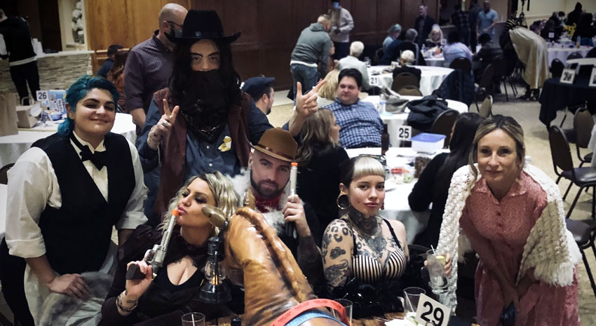 Attendees dressed in old west style clothes for ARCHway Institutes 2021 Trivia Night